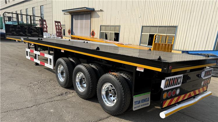 TITAN 12.5M 3 Axle Flat Deck Trailer for Sale In Tanzania - Полуприцеп-контейнеровоз/ Сменный кузов: фото 4 TITAN 12.5M 3 Axle Flat Deck Trailer for Sale In Tanzania - Полуприцеп-контейнеровоз/ Сменный кузов: фото 4