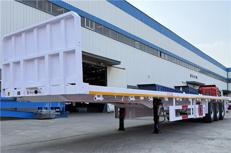 TITAN 3 Axle Flatbed Semi Trailer with Front Wall for Sale In Dominican - Полуприцеп-контейнеровоз/ Сменный кузов: фото 3 TITAN 3 Axle Flatbed Semi Trailer with Front Wall for Sale In Dominican - Полуприцеп-контейнеровоз/ Сменный кузов: фото 3