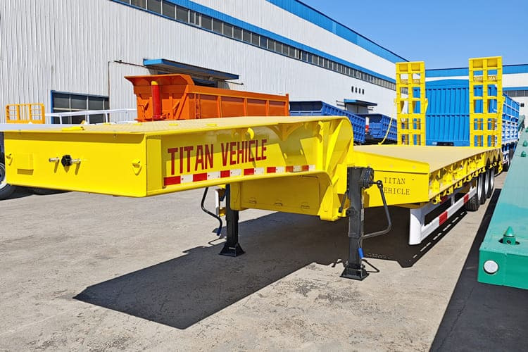 TITAN 3 Axle Low Bed Trailer Price for Sale in Kenya - Низкорамный полуприцеп: фото 1 TITAN 3 Axle Low Bed Trailer Price for Sale in Kenya - Низкорамный полуприцеп: фото 1