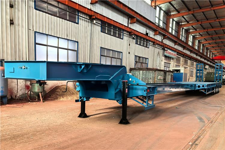 TITAN 4 Axle Extendable Low Bed Trailer for Sale In Nigeria - Низкорамный полуприцеп: фото 1 TITAN 4 Axle Extendable Low Bed Trailer for Sale In Nigeria - Низкорамный полуприцеп: фото 1