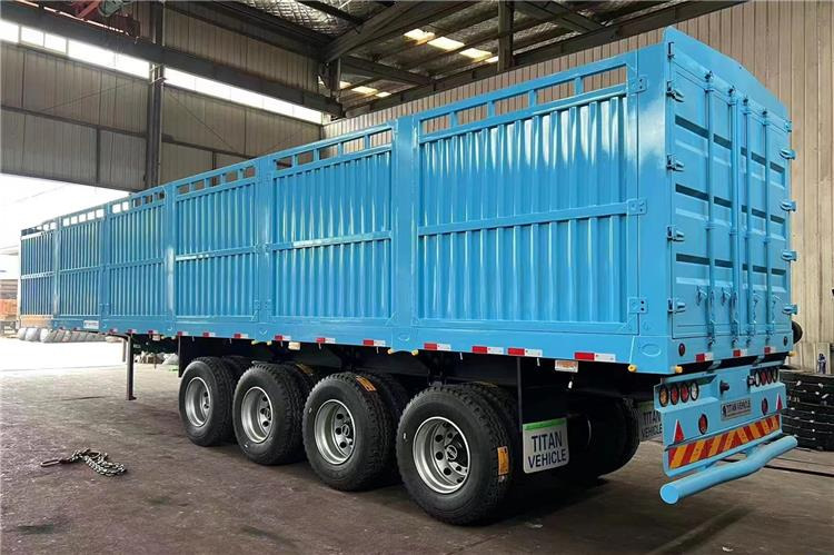 TITAN 4 Axle Fence Semi Truck Trailer for Sale price In Rwanda - Полуприцеп для перевозки животных: фото 1 TITAN 4 Axle Fence Semi Truck Trailer for Sale price In Rwanda - Полуприцеп для перевозки животных: фото 1