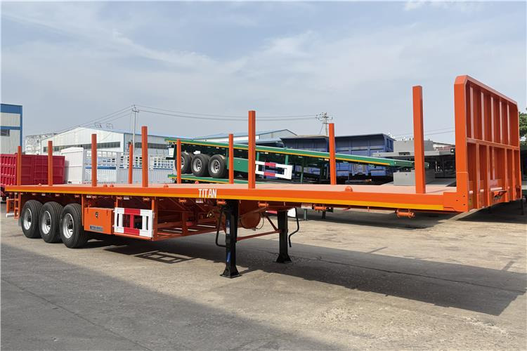 TITAN Container Flatbed Truck Trailer with Piles In Angola - Полуприцеп-контейнеровоз/ Сменный кузов: фото 1 TITAN Container Flatbed Truck Trailer with Piles In Angola - Полуприцеп-контейнеровоз/ Сменный кузов: фото 1