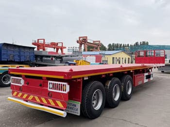 TITAN Flatbed Tri Axle Truck Trailer for Sale in Tanzania - Полуприцеп бортовой/ Платформа: фото 2 TITAN Flatbed Tri Axle Truck Trailer for Sale in Tanzania - Полуприцеп бортовой/ Платформа: фото 2