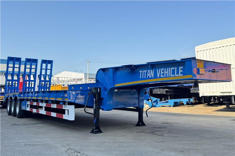 TITAN Tri Axle 80 Ton Low Loader Semi Trailer for Sale In Benin - Низкорамный полуприцеп: фото 1 TITAN Tri Axle 80 Ton Low Loader Semi Trailer for Sale In Benin - Низкорамный полуприцеп: фото 1