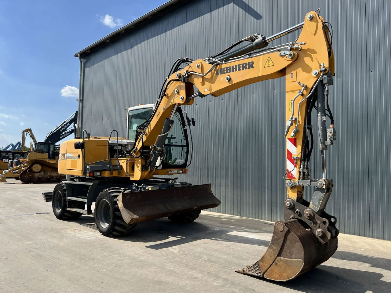 Liebherr A 311 Litronic - Строительная техника: фото 3 Liebherr A 311 Litronic - Строительная техника: фото 3