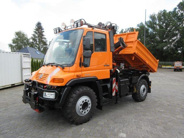Unimog U 400 three-way tipper / Atlas crane 65.2, air con - Самосвал: фото 1 Unimog U 400 three-way tipper / Atlas crane 65.2, air con - Самосвал: фото 1