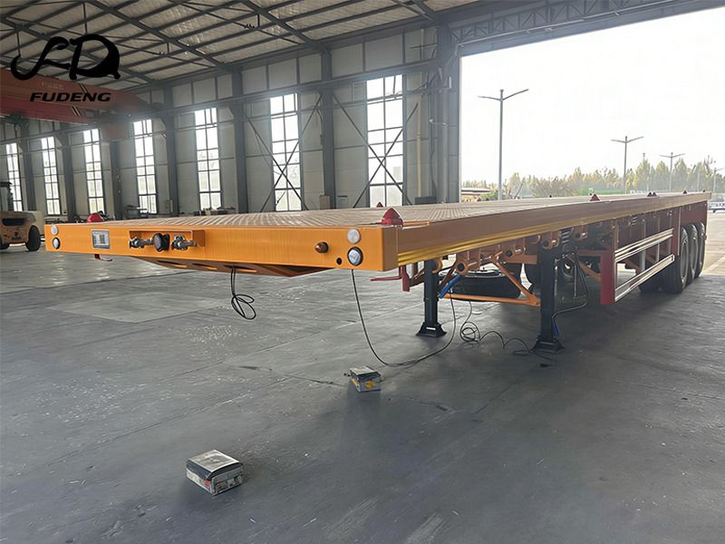 FUDENG 45FT Flatbed Container Trailer with High Strength Steel Frame for Long Distance Cargo Transport - Полуприцеп бортовой/ Платформа: фото 2 FUDENG 45FT Flatbed Container Trailer with High Strength Steel Frame for Long Distance Cargo Transport - Полуприцеп бортовой/ Платформа: фото 2