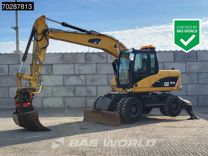 Caterpillar M313 D OUTRIGGERS + BLADE - Колёсный экскаватор: фото 1 Caterpillar M313 D OUTRIGGERS + BLADE - Колёсный экскаватор: фото 1