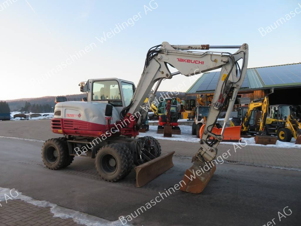 Takeuchi TB 295 W - Колёсный экскаватор: фото 1 Takeuchi TB 295 W - Колёсный экскаватор: фото 1