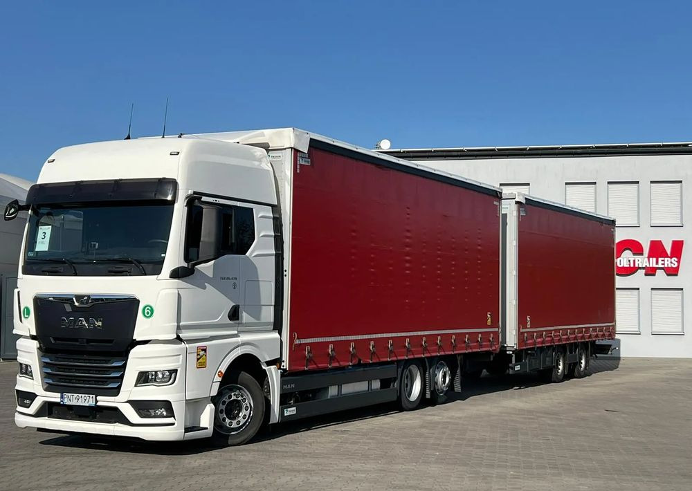 MAN TGX 26.470 z przyczepą Redos - Тентованный грузовик: фото 1 MAN TGX 26.470 z przyczepą Redos - Тентованный грузовик: фото 1