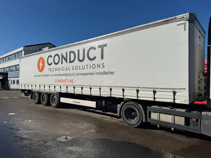 Krone SD 3 AXLE + DHOLLANDIA LIFT 2000 KG + SLING ROOF + DISC BRAKES - Тентованный полуприцеп: фото 1 Krone SD 3 AXLE + DHOLLANDIA LIFT 2000 KG + SLING ROOF + DISC BRAKES - Тентованный полуприцеп: фото 1
