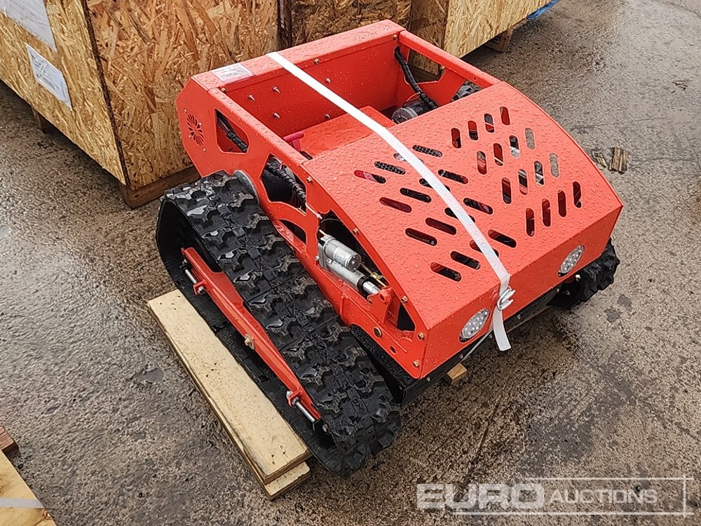Unused Tracked Remote Control Lawnmower (Remote Control in Office) - Газонокосилка: фото 1 Unused Tracked Remote Control Lawnmower (Remote Control in Office) - Газонокосилка: фото 1